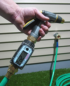 01N Digital Water Meter between garden hose and nozzle