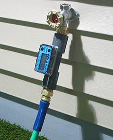 TM Digital Water Meter between spigot and garden hose nozzle