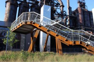 Massive steel beams support the stairway that leads up to the Mason-Hoover Trestle